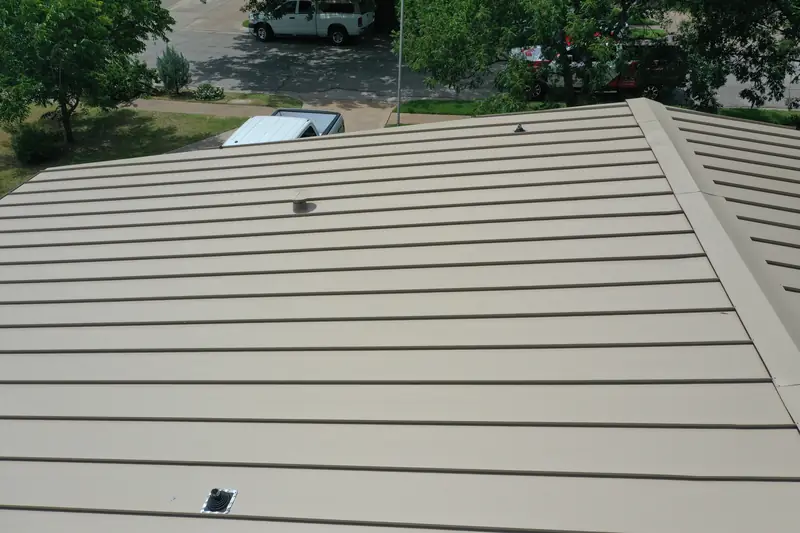 Standing seam metal panels running down a roof slope